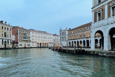 Canal amidst buildings in city