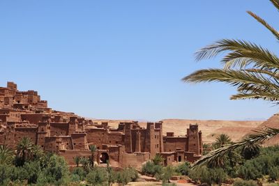 Buildings in old town against clear sky