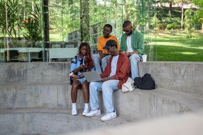 Friends using mobile phone