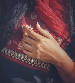 Close-up of woman hand with red tattoo