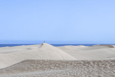 Scenic view of desert against clear sky