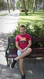 Portrait of girl sitting in park