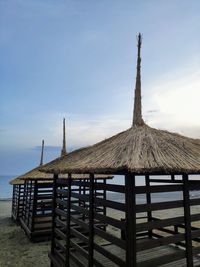 Built structure on beach against sky