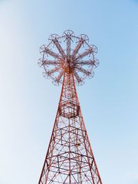 Low angle view of communications tower against sky