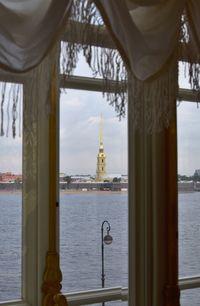 View of mosque and buildings at waterfront