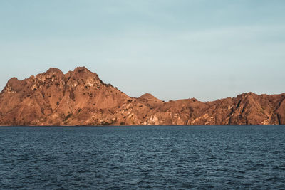 Cliff surrounding the labuan bajo sea while sailing 