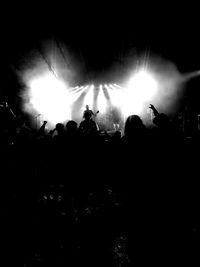 Silhouette people at music concert
