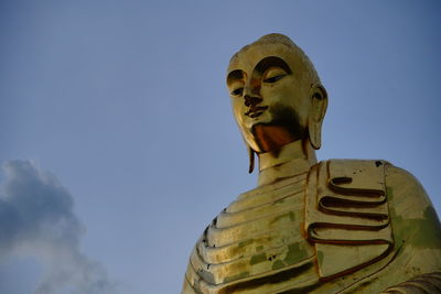 Low angle view of statue against sky