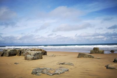 Scenic view of beach against sky