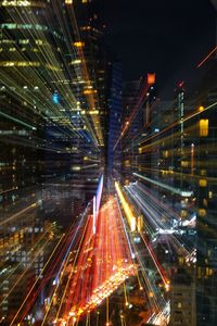 Light trails on illuminated city at night