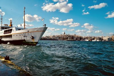 Boat sailing in sea against sky