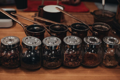 Glass jars with different types of tea leaves. herbal natural organic collection