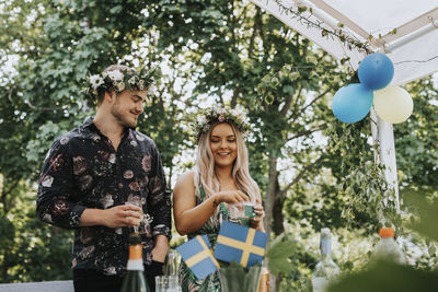 Smiling couple at garden party