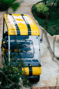 High angle view of yellow car on street