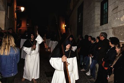 People on street in city at night
