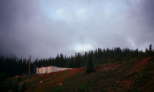 Panoramic view of trees and mountains against sky