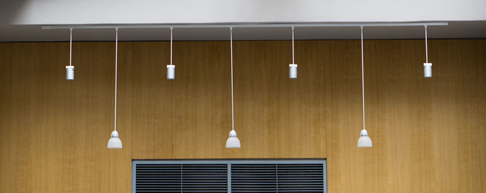 Clothes hanging on wooden wall