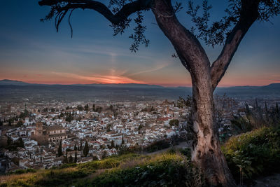 Aerial view of townscape against sky during sunset