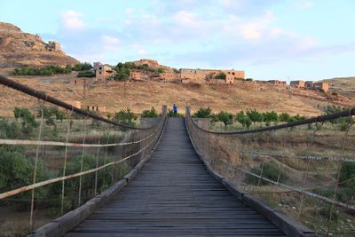 View of footbridge leading to bridge