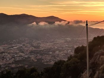 Scenic view of mountains against sky during sunset