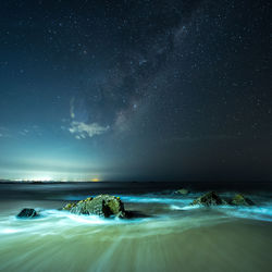 Scenic view of sea against sky at night