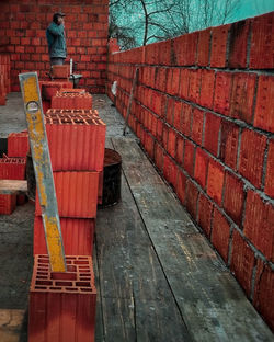 Man working on brick wall