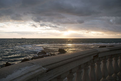 Scenic view of sea against cloudy sky