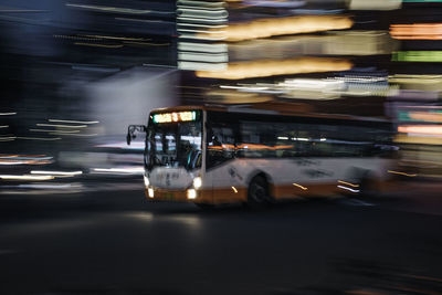 Blurred motion of car on road at night