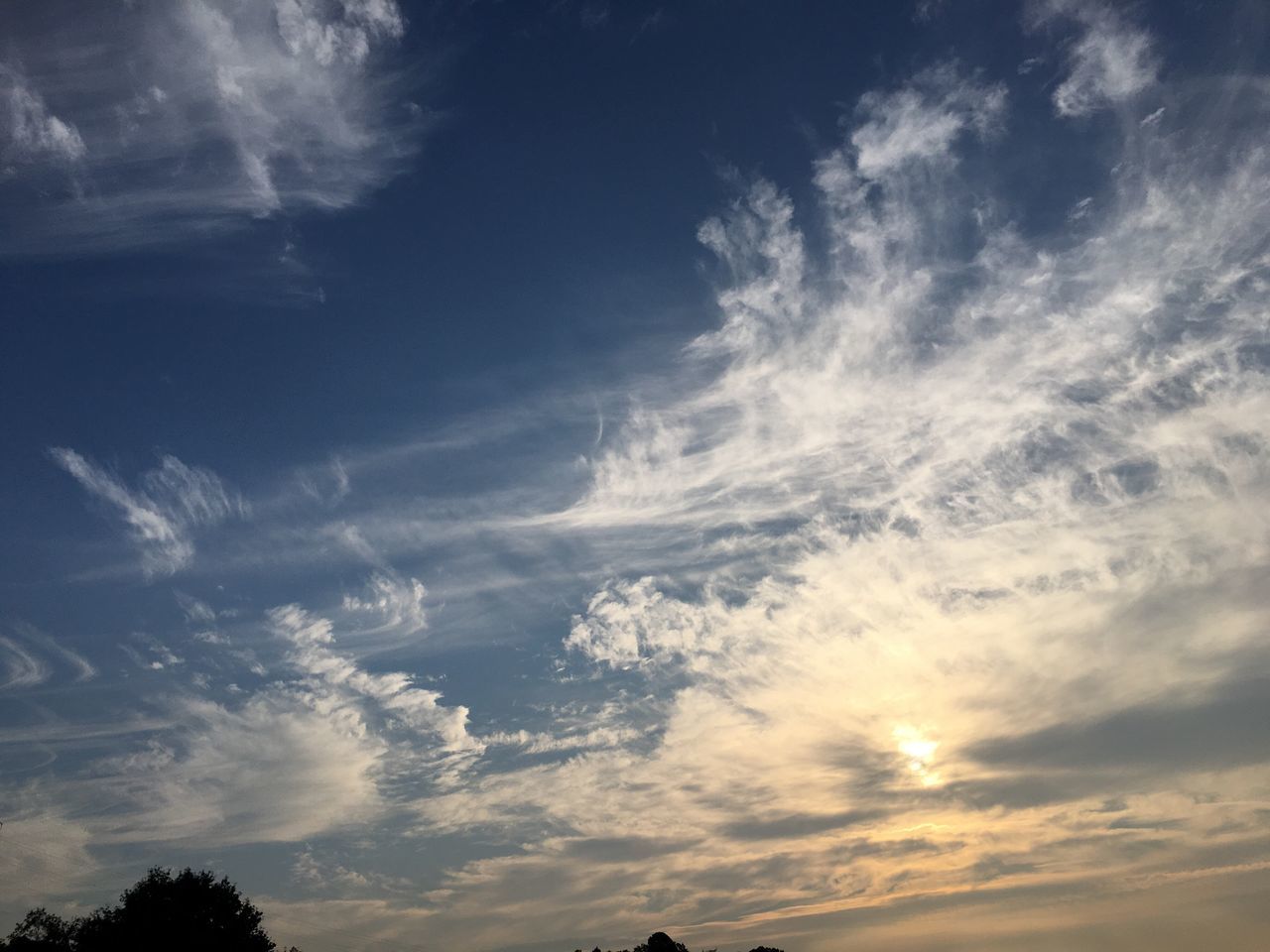 beauty in nature, scenics, sky, low angle view, tranquility, tranquil scene, nature, cloud, cloud - sky, blue, idyllic, majestic, outdoors, day, sunbeam, cloudscape, sun, outline, bright, no people, non-urban scene