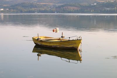 Boat moored in lake