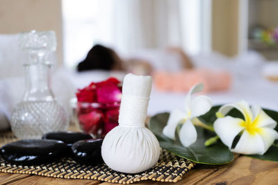 Close-up of white flowers on table at home