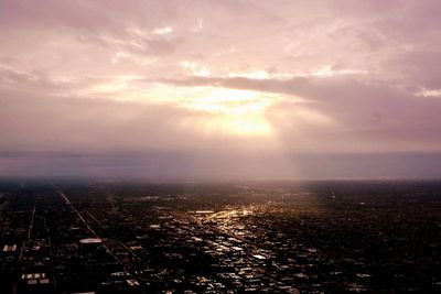 Aerial view of city at sunset