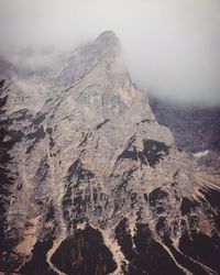 Aerial view of rocky mountains against sky