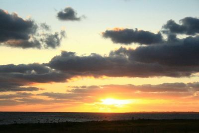 Scenic view of sea at sunset