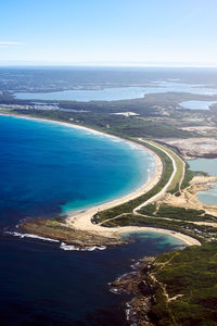 High angle view of bay against clear sky