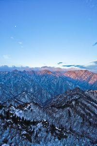 Scenic view of landscape against blue sky