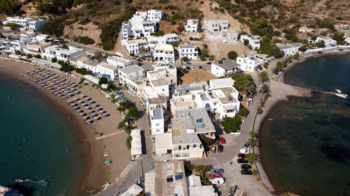 High angle view of kapsali bay buildings and trees in greek island 