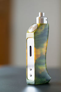 Close-up of bottle on table against white background