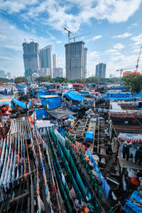 High angle view of buildings in city against sky