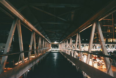 Footbridge in city at night