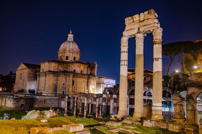 Historic temple against sky at night