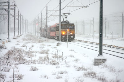 Train driving in the snow in amsterdam the netherlands in winter