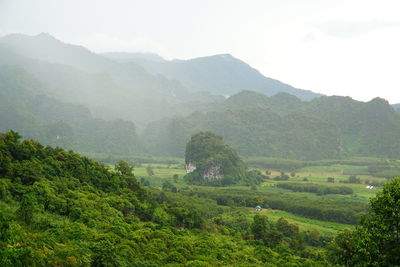 Scenic view of landscape and mountains against sky