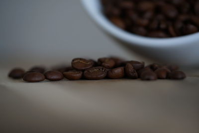 Close-up of coffee beans on table