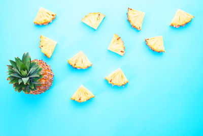 High angle view of candies against blue background