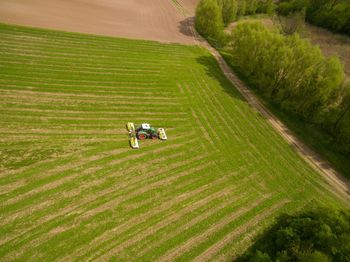 High angle view of person riding motorcycle on field