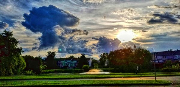 Houses on field against sky