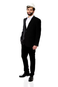 Portrait of man standing against white background