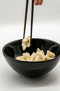 Close-up of person hand in bowl