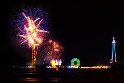 Firework display at night